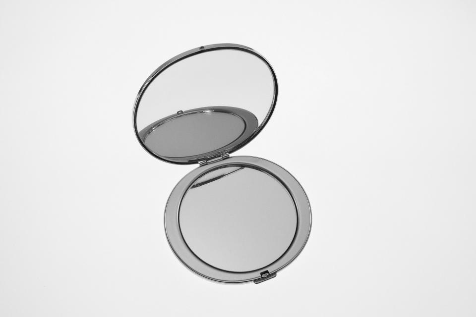 True Decadence structured grab bag in silver mirror with ring handle | ASOS